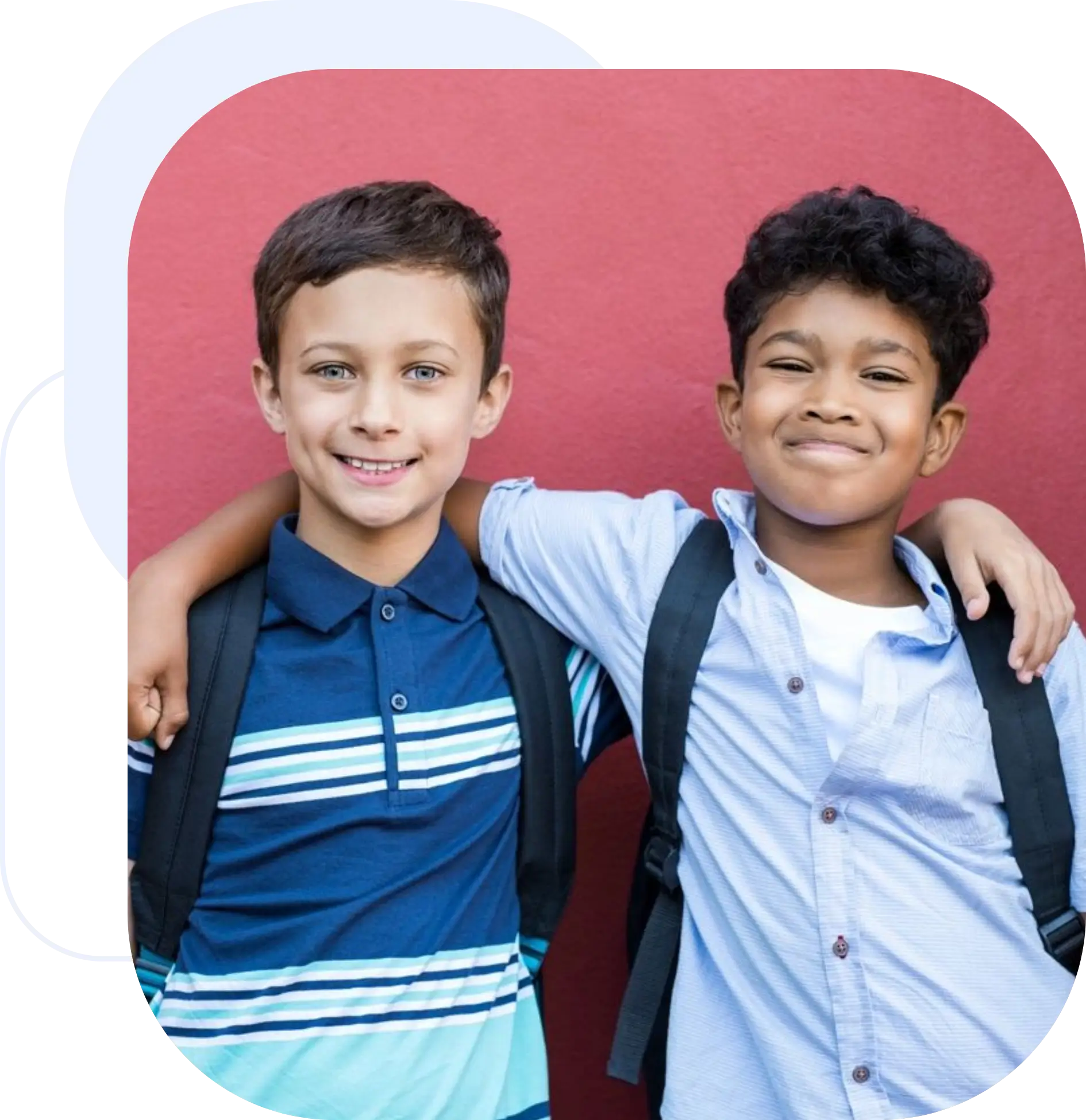 Two boys smiling with arms around each other against a pink background.